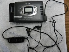 AS IS SEMI WORKS VINTAGE SONY WALKMAN WM-FX613  REMOTE HEADPHONES MDR-EW2FR