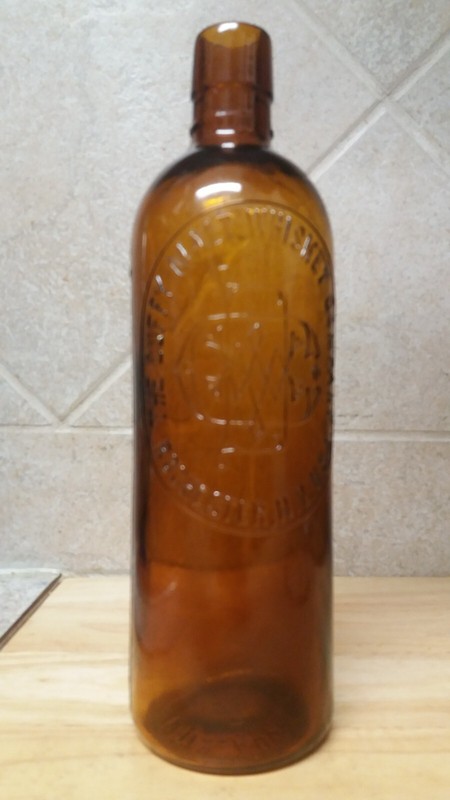 The Duffy Malt Whiskey Company Embossed Amber Bottle