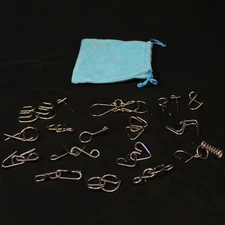 33 Piece Metal Brain Teaser Puzzle With Blue Velvet Bag