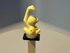 bright light yellow LEGO Friends monkey figure with lime eyes 41032