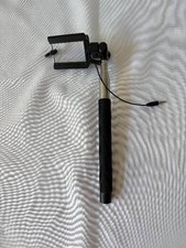 Black extendable wired selfie stick with a universal phone clamp