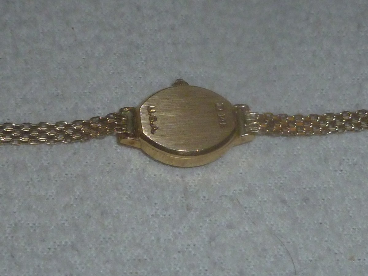 LADIES 14K GOLD GENEVE SWISS QUARTZ WRIST WATCH VINTAGE WOMANS OVAL FACE USA Vintage Geneve 14K Yellow Gold Diamond Ladies Watch Swiss  main image 2