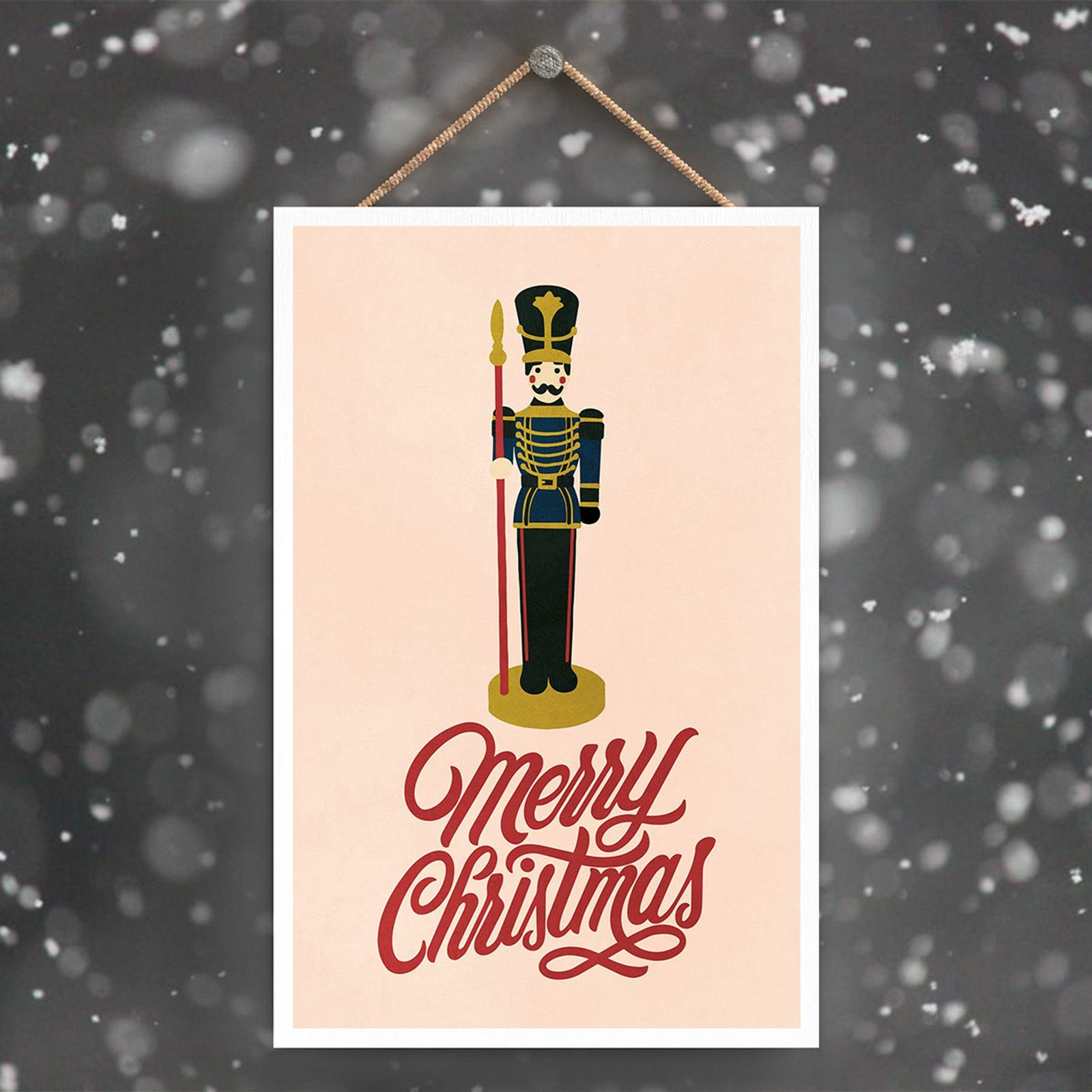 MERRY CHRISTMAS NUTCRACKER AND TYPOGRAPHY ON A PINK RECTANGLE PORTRAIT PLAQUE