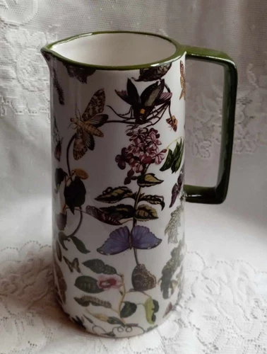 Collectible 9" tall Ceramic fairy/insect green & white Water Pitcher