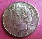 1925-S PEACE SILVER DOLLAR. HIGH GRADE. WITH SOME LUSTER.