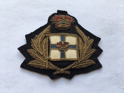 VINTAGE ORIENT LINE BULLION CAP BADGE