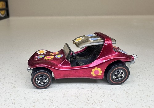 Multi colored Redline Hot Wheels in a cherry display case Stock Photo