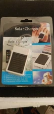 WHITE - MINI solar powered iphone charger ( can be charged up to 500 charges )