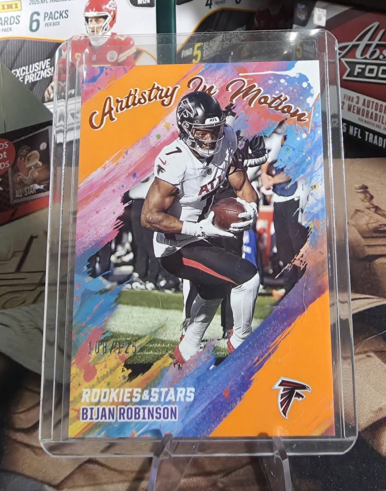2025 Rookies & Stars Bijan Robinson Artistry in Motion Orange /125 Falcons 