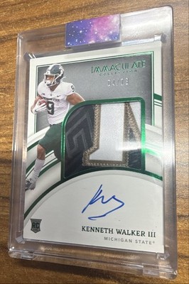 Rookie Patch Autographs Kenneth Walker III #65 Emerald /13 (AU, MEM, RC)