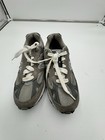 Grey New Balance 991 dark grey size 7 with white laces, suede overlays, and mesh uppers on a white background.