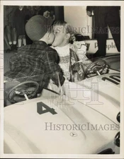 1957 Press Photo Thierry Van Santen giving"kisses" at kiddie-car race, Paris