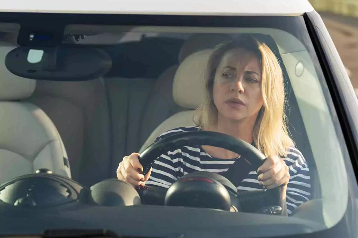 A female driver looks concerned.