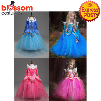 sachin and babi light blue dress A young woman girl model wearing a 'fairy tale' big red pink cerise ball  gown party frock outdoors, UK Stock Photo