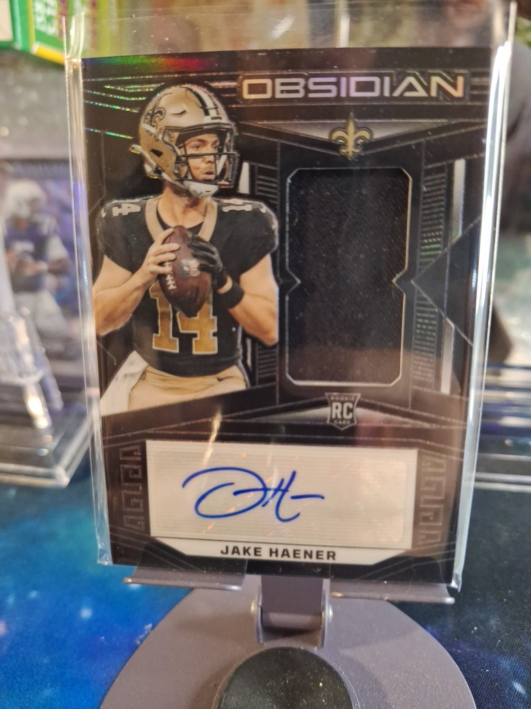 2023 Panini Obsidian - Rookie Jersey Autographs Jake Haener #207 /199 (AU, MEM,