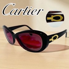 Lunettes de soleil Cartier décor C monture en métal pour femmes