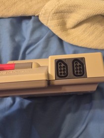 Classic NES game console. 2 controllers and NES advantage in box with packaging