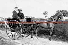 F014564 Man and Women Sit In a Horse Drawn Cart