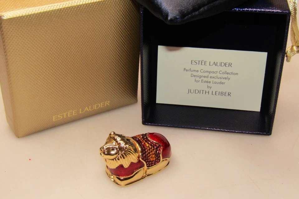 Perfume sólido Estee Lauder Beyond Paradise Legendary Lion de Judith Leiber con caja Foto 2 de 4