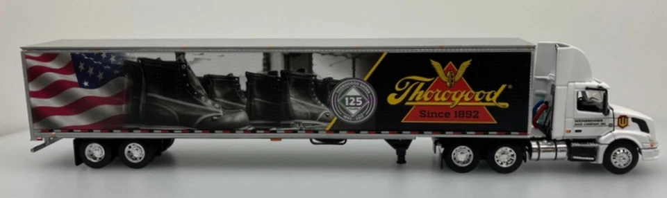 Volvo VNL 300 DCP 1:64 cabina corta con remolque de mercancías secas 53': zapatos Thorogood Foto 2 de 4