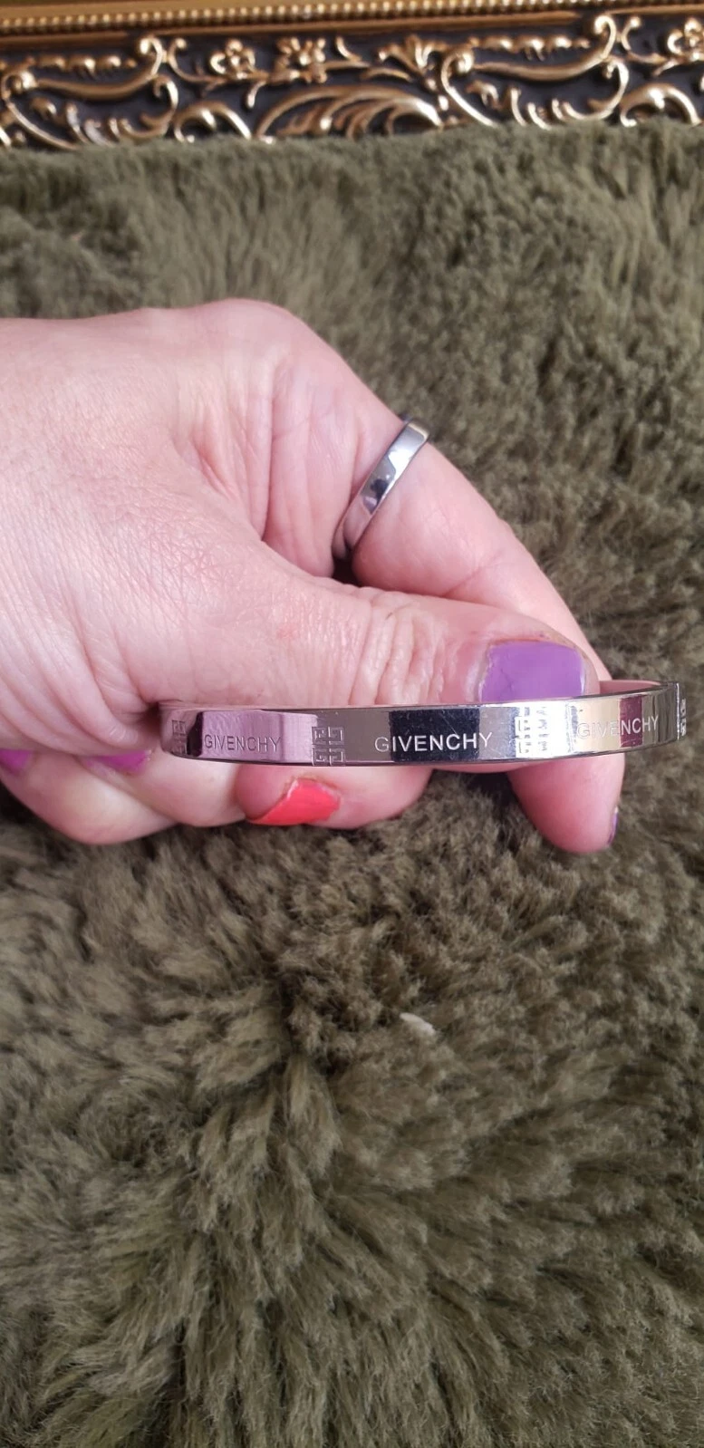 Givenchy Bracelet. Stainless steel. Bit oval shape. V g condition. Unisex