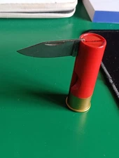 Folding pocket knife, rifle cartridge, Italy, red