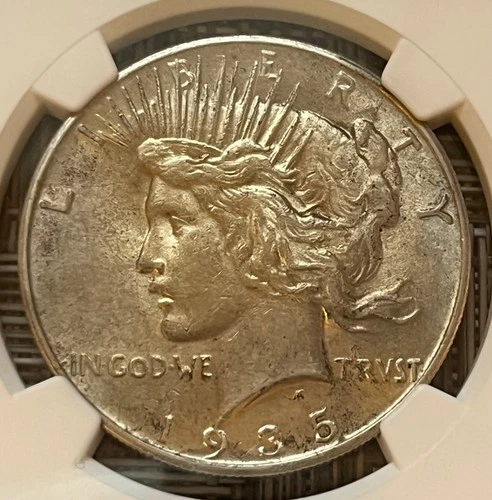 1935 Peace dollar, NGC graded AU-58 - better date
