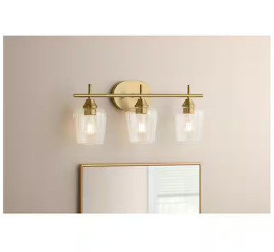 Hampton Bay Pavlen 24'' 3 Light Vanity Light Antique Brass Clear Glass GS W070807