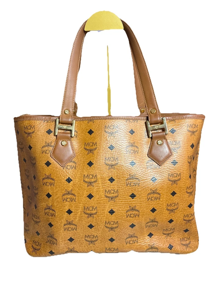 This is an MCM Visetos monogram tote bag with leather trim and a central stripe. - Image 3 of 4