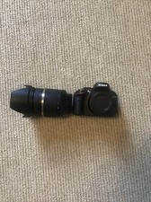 Digital NIKON Camera With Attachable TAMRON lens.