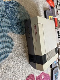 Original Nintendo, 6 controllers,duck hunt gun NES four score and five games.