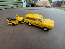 Tonka Yellow Wagoneer with trailer and Snowmobile