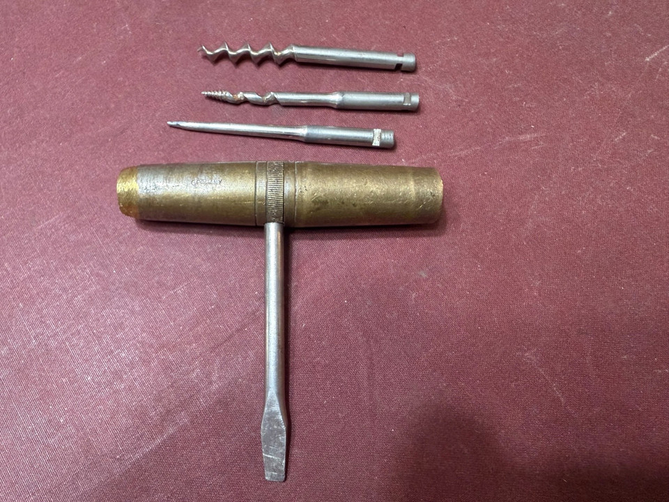 A gorgeous vintage brass German pocket multitool with corkscrew, pick, screwdriver, and drill — the kind of beautifully machined old-world EDC that modern multitools can't replicate.