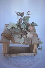 WOOD AND FAUX FLORAL NOVELTY BIRD HOUSE