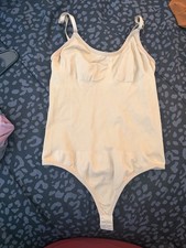 beige ribbed shapewear thong bodysuit featuring adjustable spaghetti straps Xl