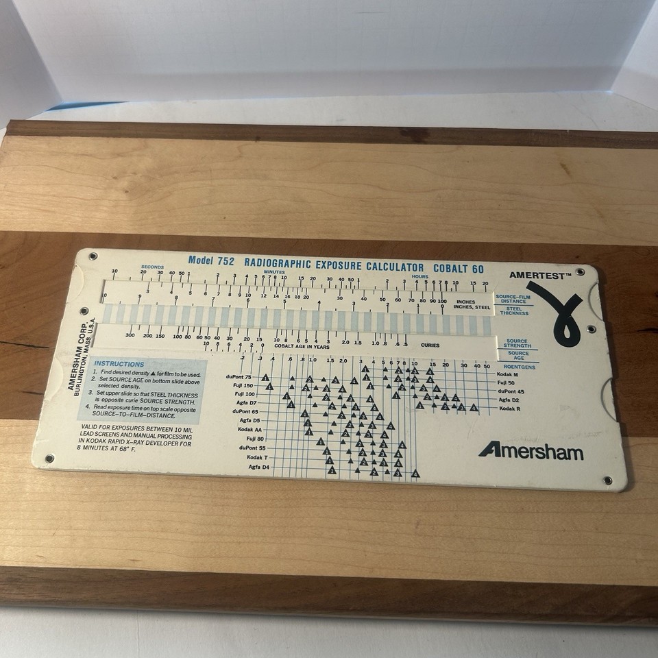 A 1989 radiographic exposure calculator slide rule — a gorgeous analog computational tool used by X-ray technicians, and a totally obscure nerdy artifact almost nobody has ever seen.