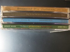 4 CDs: Spyro Gyra; Enya; Diamond Rio & Sergio Mendes -- All Greatest Hits CDs