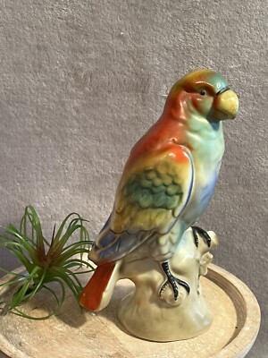 Red/green/yellow parrot with blue belly/wing tips. Made In Germany