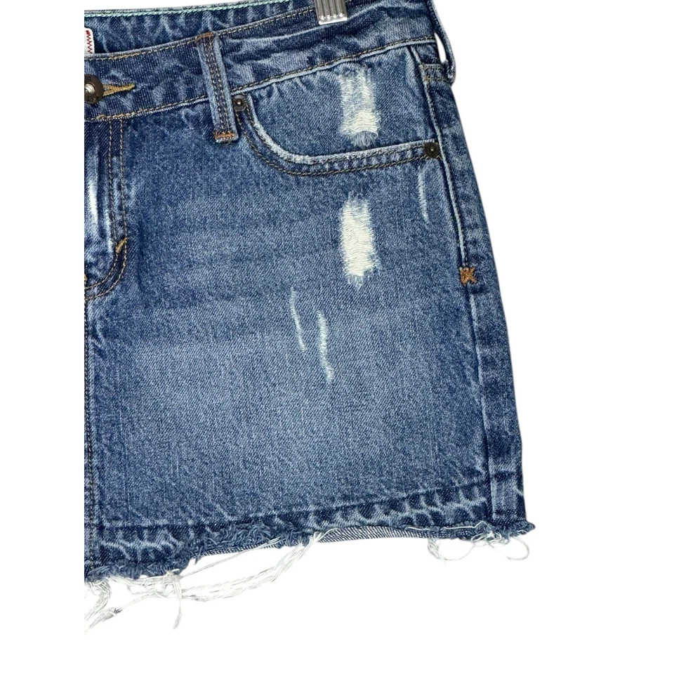 Mini falda de mezclilla inclinable para mujer 7 Y2K tiro bajo dobladillo crudo Britney Paris Grunge Foto 3 de 4