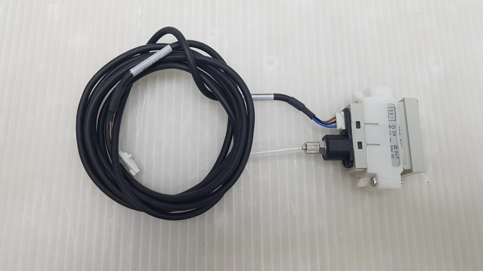 SUNX DP4-52Z in its mounting bracket with connector cable and clear pressure tube