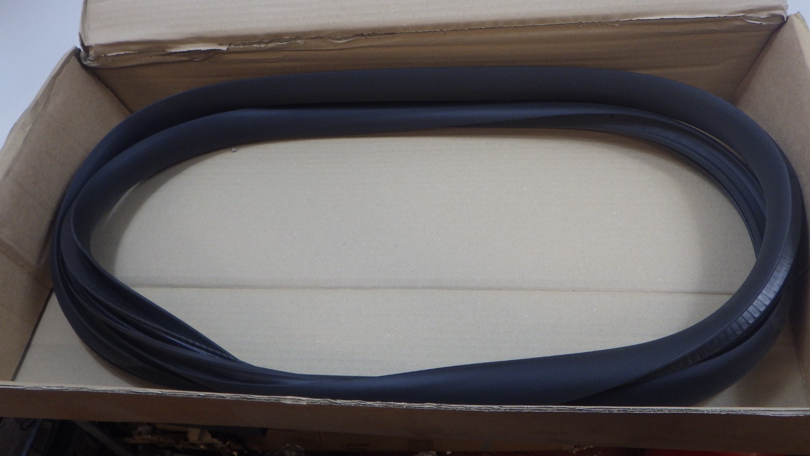 Tesla Model Y door seal left rear on body genuine new 1497675