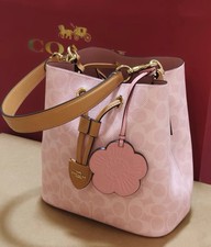 NWT Coach CEA23 Rowan Bucket Bag In Signature Canvas With Charms Powder Pink