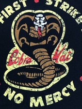 Official Netflix COBRA KAI STRIKE FIRST THEN HARD NO MERCY KARATE Mens T-shirt L