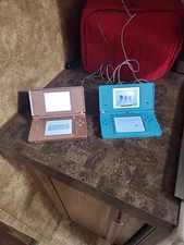 Official Nintendo 2006 DS Lite Rose Mettalic With Game and Charger. Also Blue Ds