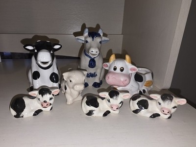 7 Moo Cows: 2 Are Creamers, 1 Toothpick Holder, 1 Sponge Holder, 3 Figurines.