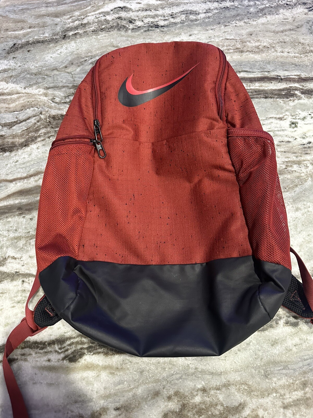 Nike Book bag Red With Black Speckles.