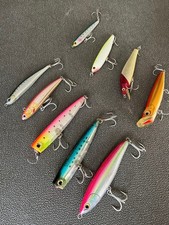 Lot of 9 saltwater lures, including Loaded and Pop Queen, etc.