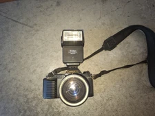 Canon T50 Camera with flash and 1.35-4.5 lens untested