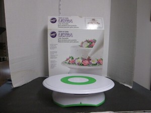 Wilton Cake Decorating Turntable Ultra Trim-N-Turn. Can lock into place too