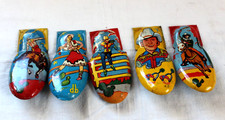 5 vintage Kirchhof Tin Litho Cowboy Cowgirl Metal Clicker Noise Maker toy